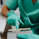 A Dentist Holding a Dental Shade Guide